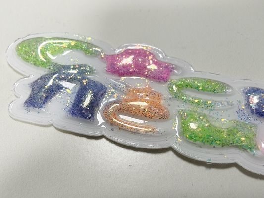 Nachhaltige, kundenspezifische, funkelnde, rosa, gelbe TPU-Pflaster, geschwollene Etiketten für Kleidung