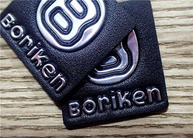 Schwarzes prägeartiges Lederflicken mit silbernem Logo der Prägungs-TPU für Taschen