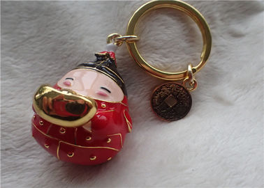 Chinesische Art-keramischer fetter Baby-Goldbarren-Schlüsselanhänger im roten Mantel