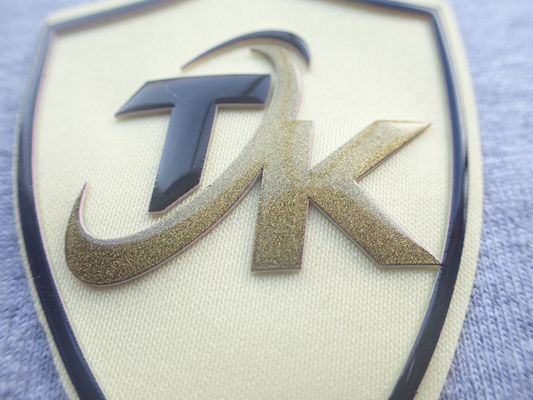 Freundlicher kundenspezifischer gesponnener Siebdruck Eco, der Flecken mit Silikon-Logo druckt
